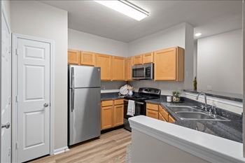 Kitchen with stainless steel appliances and wooden cabinets